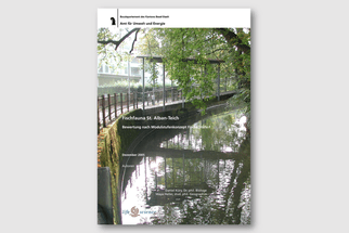 Bericht mit Bild von Fluss und Bäumen im Hintergrund.