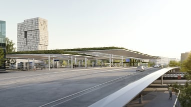 Die Margarethenbrücke und die künftige Tramhaltestelle auf der Margarethenbrücke mit begrüntem Dach. Im Hintergrund ist ein großes, würfelförmiges Gebäude zu sehen, das Meret Oppenheim-Hochhaus. 