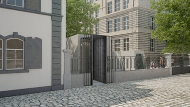 Gepflasterter Weg vor einem modernen Gebäude mit Bäumen.