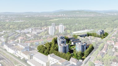 Luftaufnahme von Hochhäusern im Grünen in einer Stadtlandschaft.