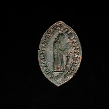 Spätmittelalterlicher Siegelstempel des Domkantors Rudolf Kraft. Er wurde im Oktober bei archäologisch begleiteten Unterwasserarbeiten am Fuss der Pfalzmauer entdeckt.