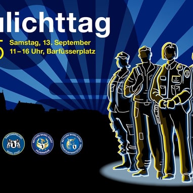 Blaulichttag 2025 mit Silhouetten von Rettungskräften
