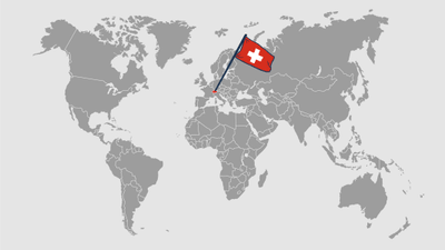 Graue Weltkarte mit Schweizer Fahne positioniert in Europa.