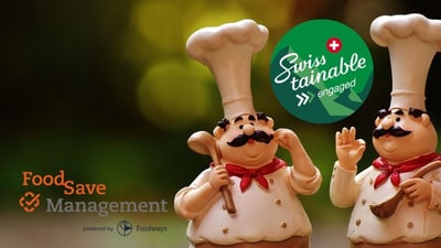 Zwei Chefkochfiguren mit 'Swiss Sustainable' Logo im Hintergrund.
