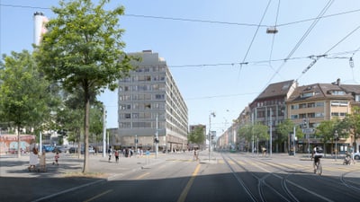 Stadtstrasse mit Radfahrer und Strassenbahnlinien.