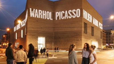 View of the new Kunstmuseum Basel building with young people in the foreground.