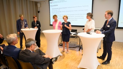 Panel discussion during the Basel 2023 networking event.