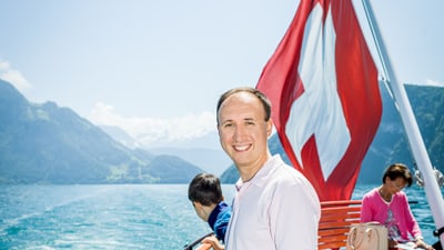 Portrait of Dmytro Kryvko on a boat on Lake Lucerne.