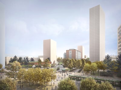 Stadtansicht mit hohen Gebäuden und Bäumen im Vordergrund.